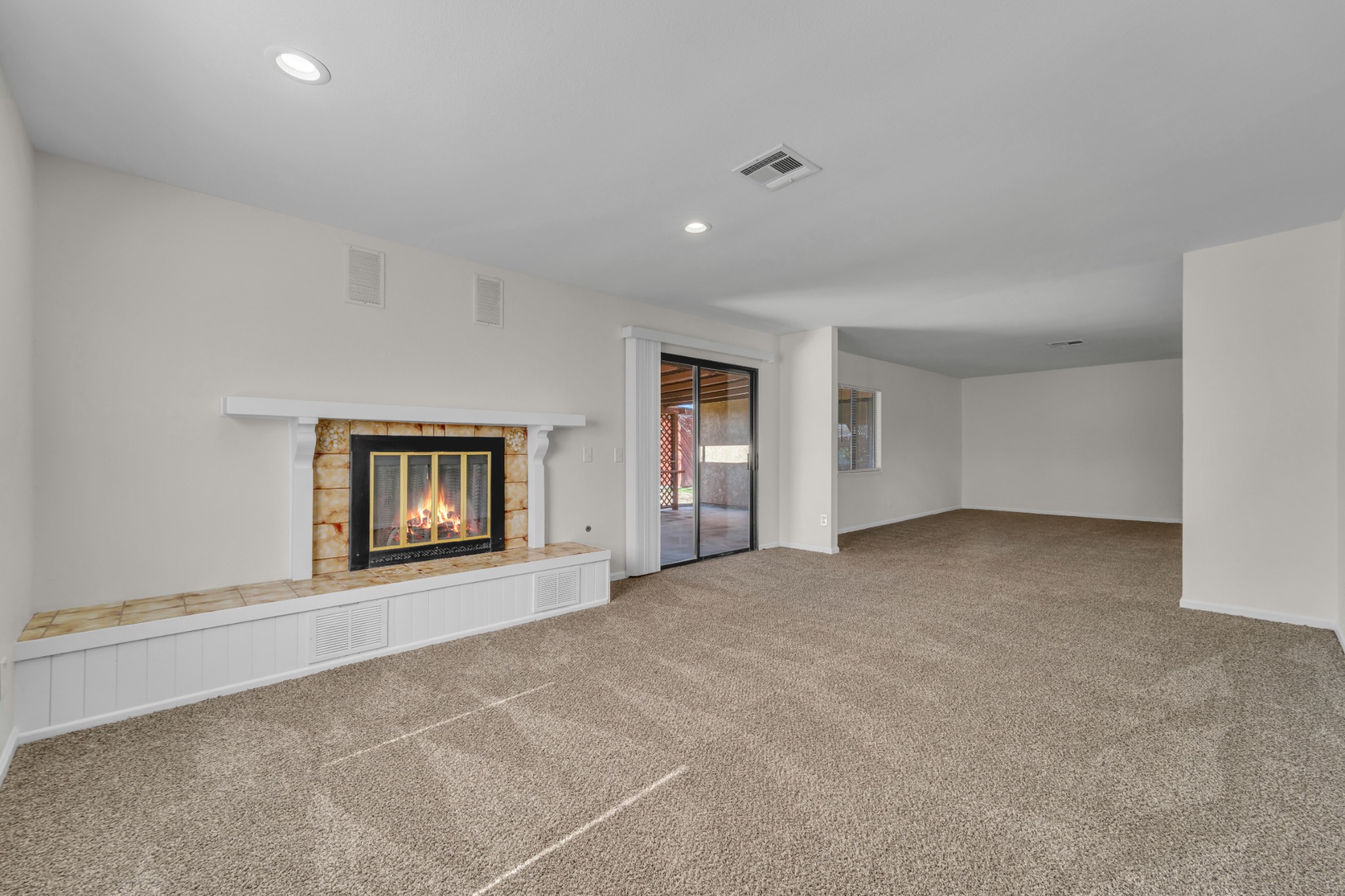 Family room with fireplace at 42865 Normandy Lane